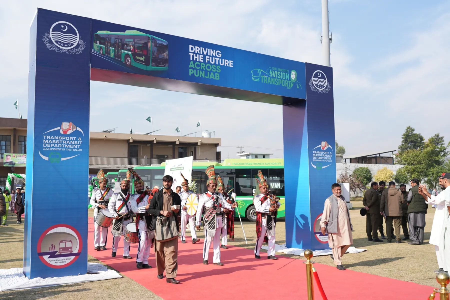 Branded entrance gate at an outdoor launch event